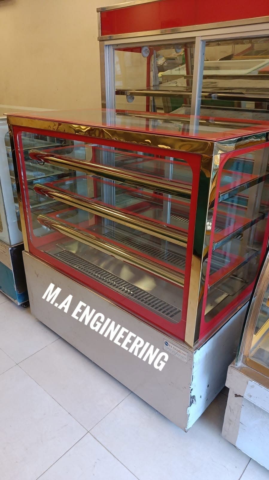 Red and gold display showcase by M A Engineering